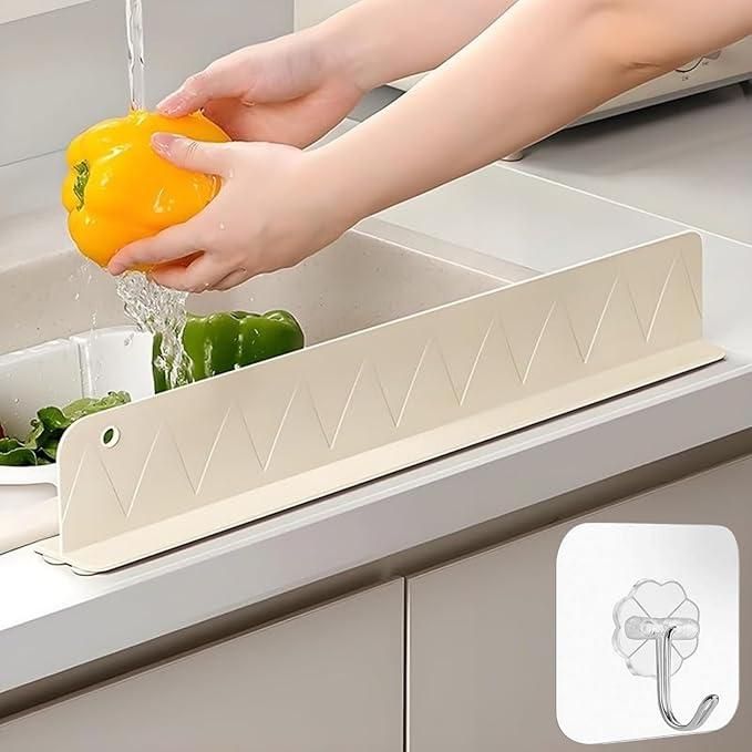 Person washing a yellow bell pepper over a white kitchen sink with (draining rack) in the foreground.