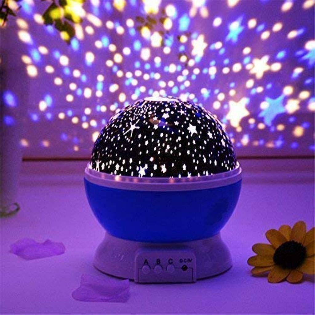 Starry night light projector with colorful star patterns on a wall